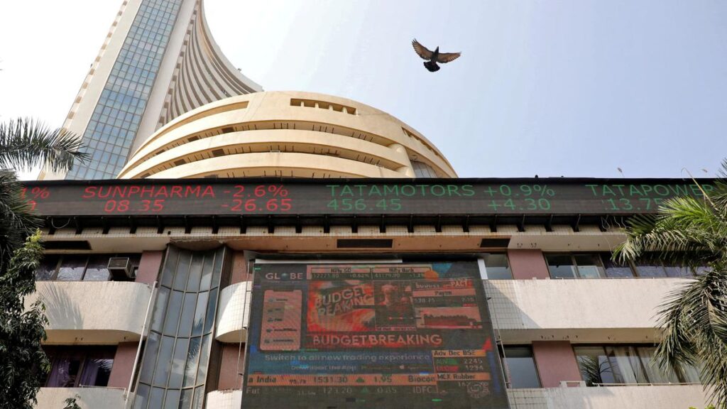 Sensex edges lower 15 points, Nifty retreats from record highs to end flat