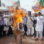 ‘Holika of corruption’: BJP burns effigies of AAP supremo Arvind Kejriwal, seek resignation of Delhi CM