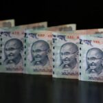 Rupee opens flat against US dollar in early trade