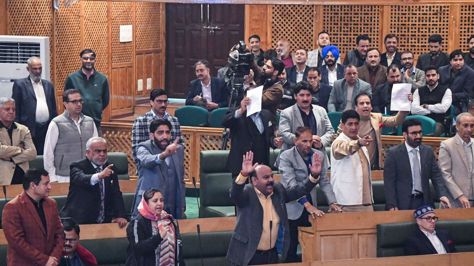 J&K news: Ruckus in Assembly as Engineer Rashid’s brother displays banner on Article 370, house adjourned | Watch